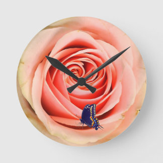 A rose and a butterfly round clock