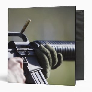 A round flies from the chamber of an M-16A2 Binder