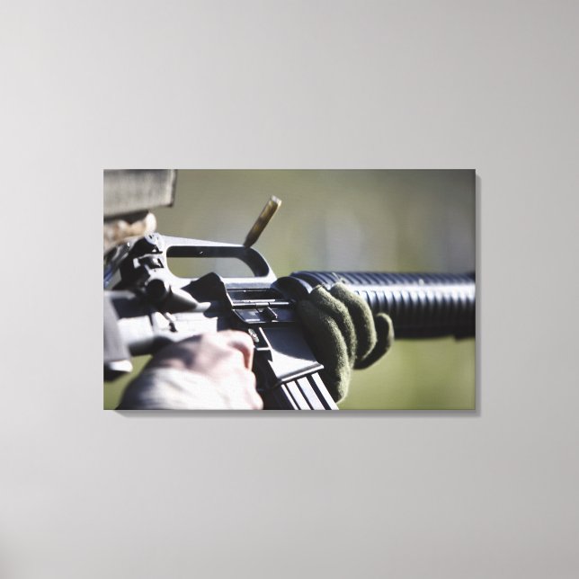 A round flies from the chamber of an M-16A2 Canvas Print (Front)