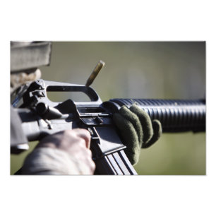 A round flies from the chamber of an M-16A2 Photo Print