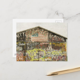  A rural barn covered in graffiti  Postcard