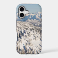 A Scenic View of Snowy Mountains and Trees.