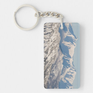 A Scenic View of Snowy Mountains and Trees. Keychain