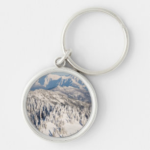 A Scenic View of Snowy Mountains and Trees. Keychain