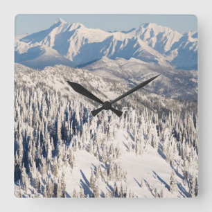 A Scenic View of Snowy Mountains and Trees. Square Wall Clock