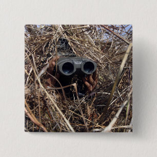 A scout observer practices observation techniqu 2 inch square button