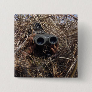 A scout observer practices observation techniqu 2 inch square button