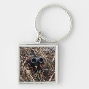 A scout observer practices observation techniqu 2 keychain