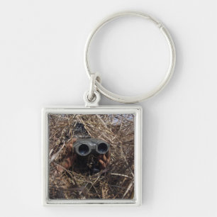 A scout observer practices observation techniqu keychain