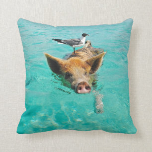 A sea gull and a pig throw pillow