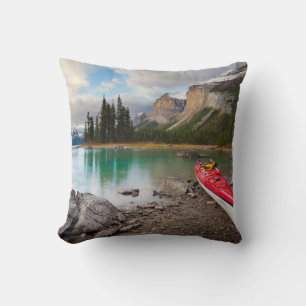 A sea kayak ashore at Spirit Island Throw Pillow