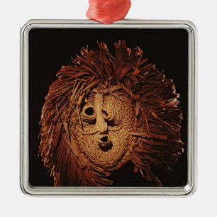 A Seneca mask used in winter rites Metal Ornament