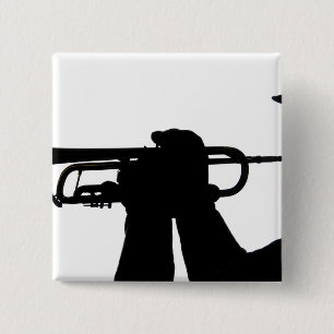 A service member plays a tune 2 inch square button