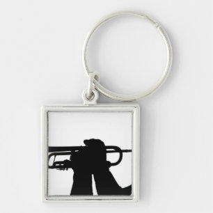 A service member plays a tune keychain