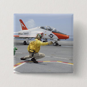 A shooter aboard the aircraft carrier 2 inch square button