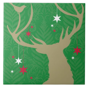 A silhouette of a deer with stars hanging from its tile