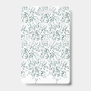 A silver drop splashes into a pool of white liquid badge