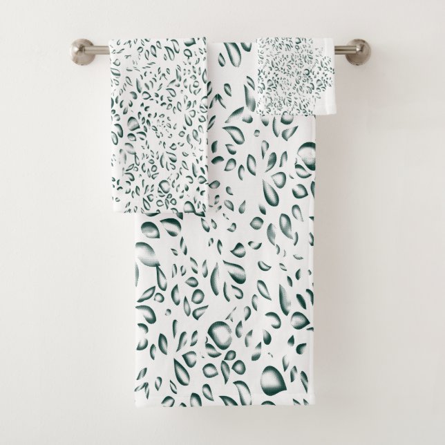 A silver drop splashes into a pool of white liquid bath towel set (Insitu)