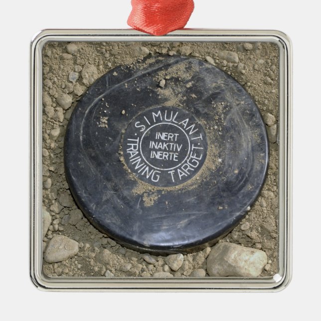 A simulated land mine metal ornament (Front)