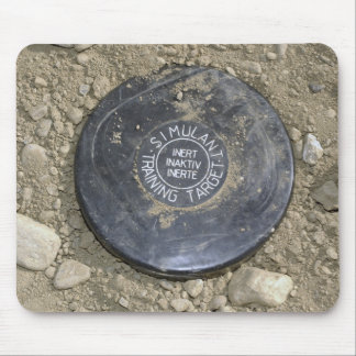 A simulated land mine mouse pad