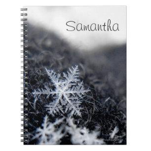 A single snowflake on stands out notebook