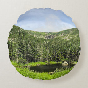 A small pond in the valley of the mountains in the round pillow