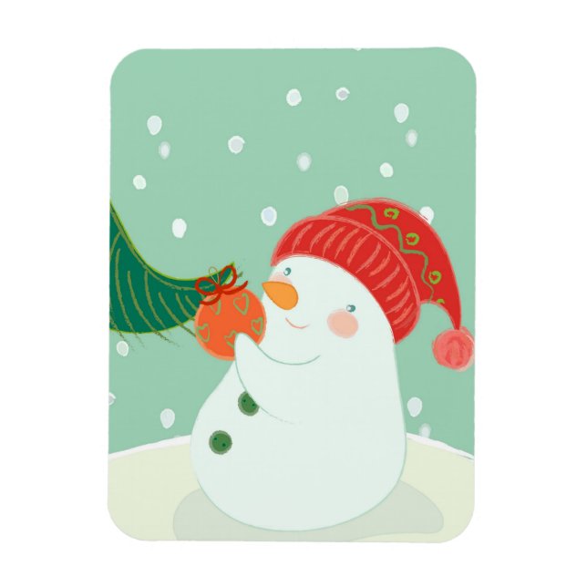 A snowman hanging an ornament on a tree magnet (Vertical)