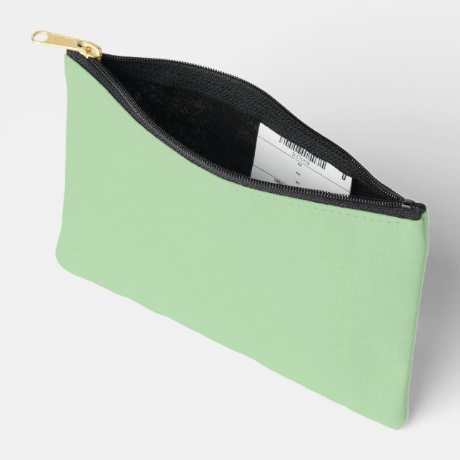 A soft pale green background fills the image accessory pouch (Open)