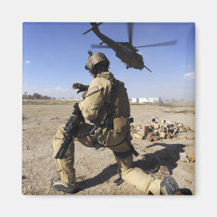 A soldier conducts security for an HH-60 Magnet