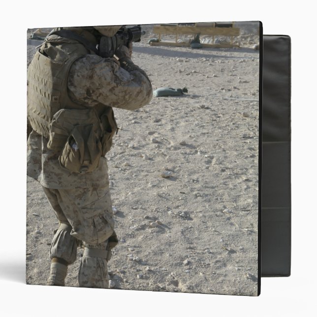 A soldier engages his target on a shooting rang binder (Front/Inside)