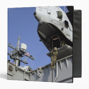 A soldier fast-ropes binder