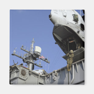 A soldier fast-ropes magnet