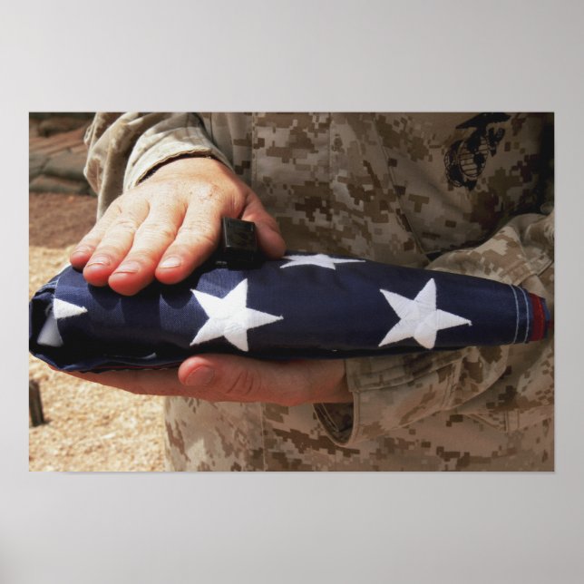 A soldier holds the United States flag Poster (Front)