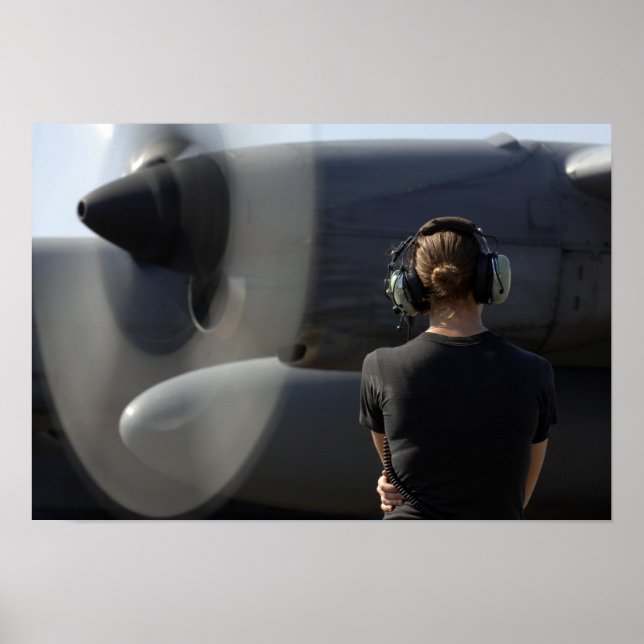 A soldier monitors the performance poster (Front)