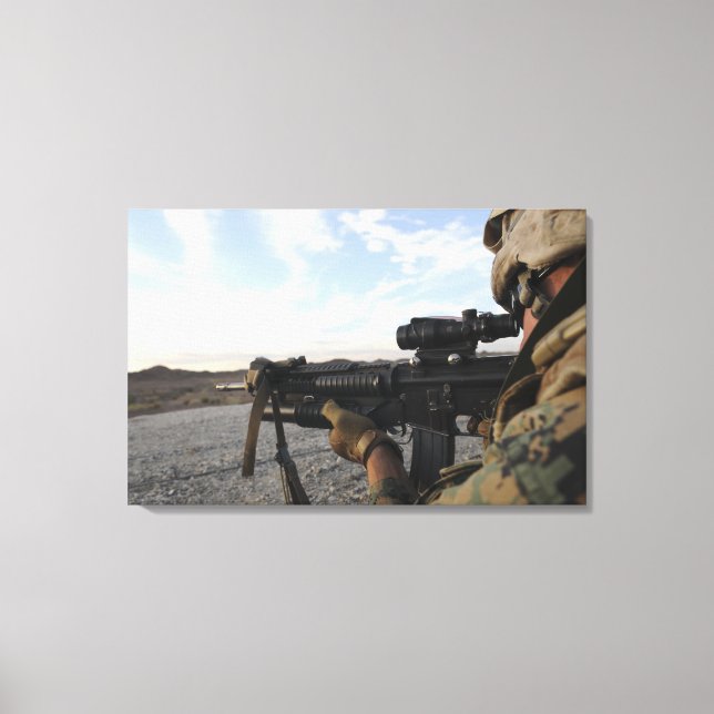 A soldier sights in to fire on a target canvas print (Front)