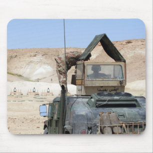 A soldiier instructs an Iraqi army soldier Mouse Pad