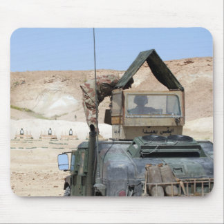 A soldiier instructs an Iraqi army soldier Mouse Pad