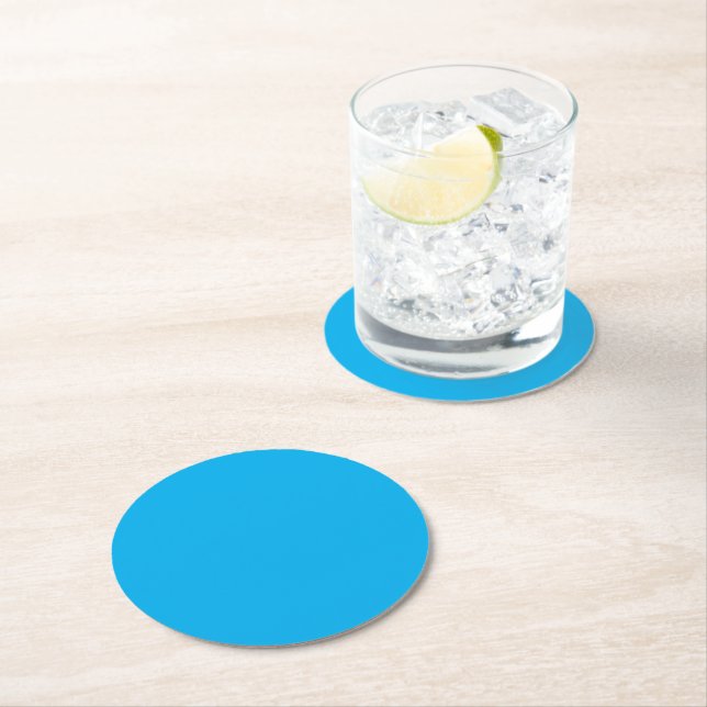 A solid blue background fills the entire image round paper coaster (Insitu)