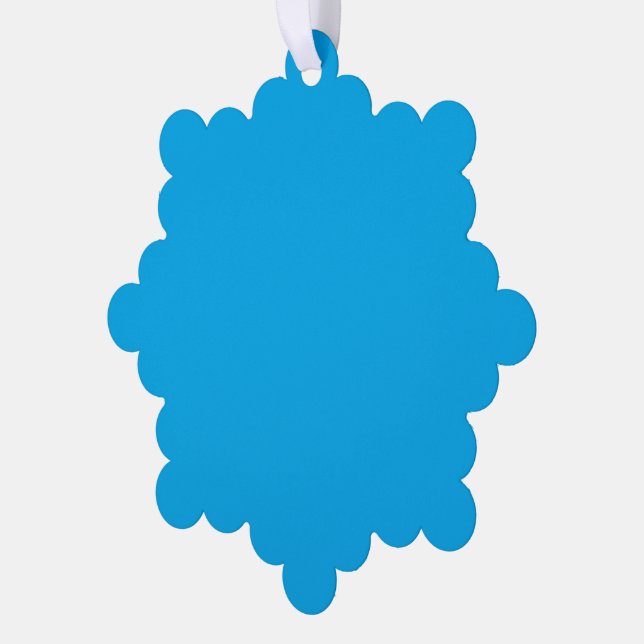 A solid bright blue background fills  ornament card (Left)