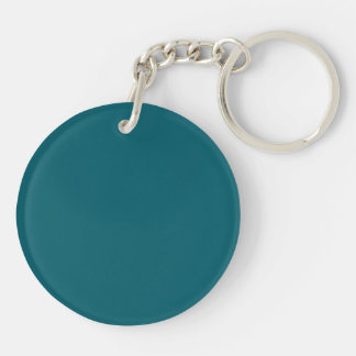 A solid teal background fills the image keychain