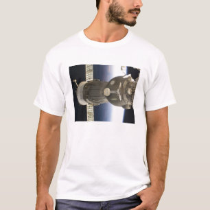 A Soyuz spacecraft backdropped by Earth T-Shirt