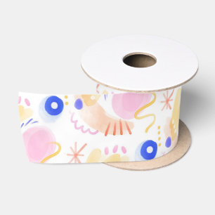 A spool of ribbon featuring abstract pastel shapes satin ribbon