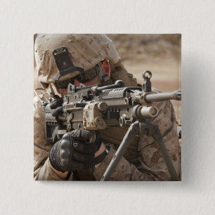 A squad automatic weapon gunner provides securi 2 inch square button