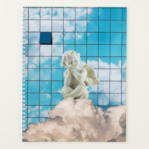 A statue of an angel on a cloud planner