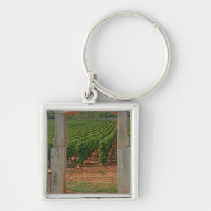 A stone portico to the vineyard keychain