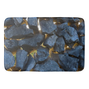 A stone wall built in Croatian style Bath Mat