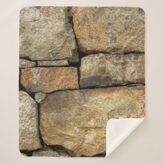 A stone wall made of cobblestones background textu sherpa blanket