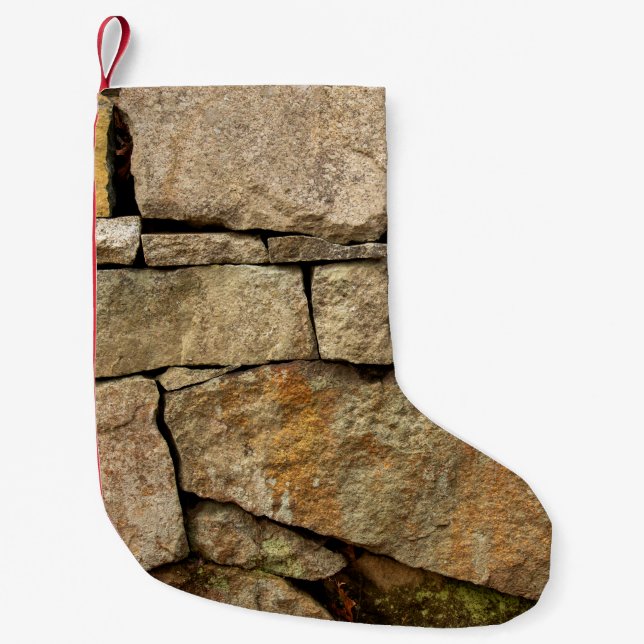 A stone wall made of cobblestones background textu small christmas stocking (Front)
