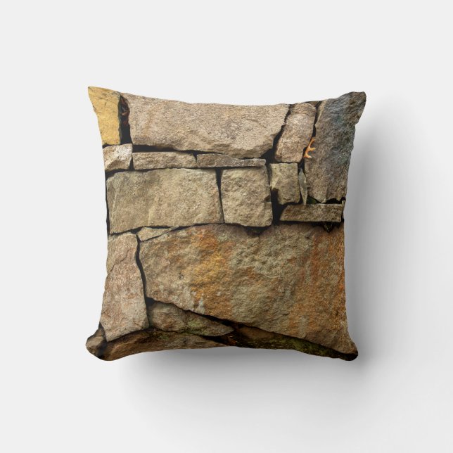 A stone wall made of cobblestones background textu throw pillow (Front)