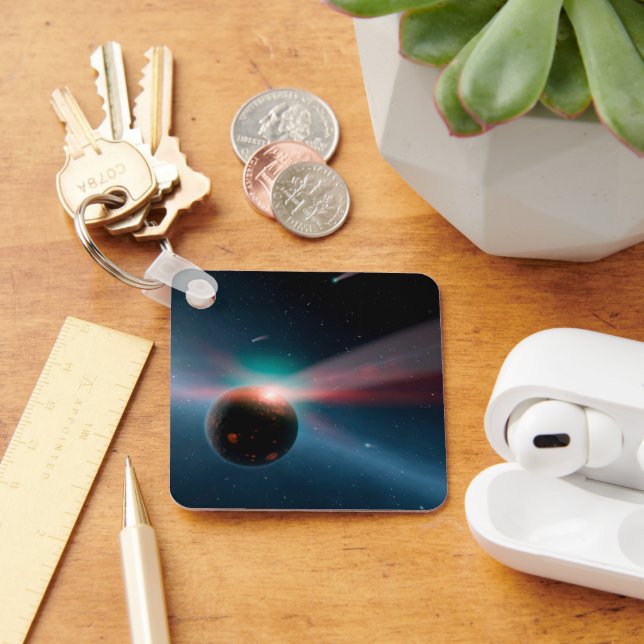 A Storm Of Comets In The Eta Corvi System. Keychain (Desk)
